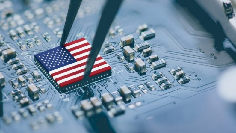 Microchip with US flag design placed on a printed circuit board